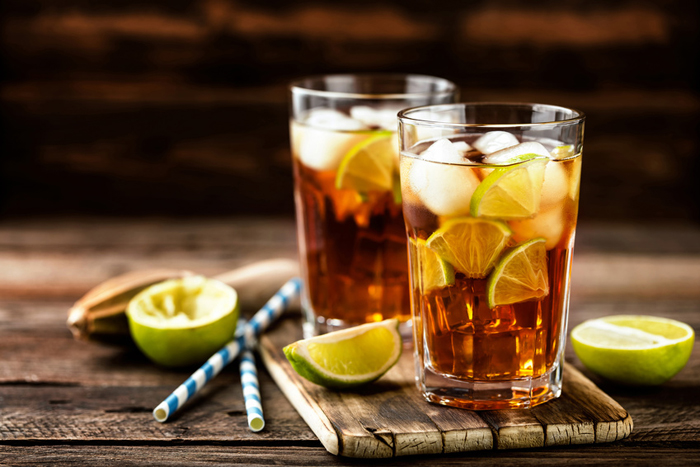 Cuba Libre or long island iced tea cocktail with strong drinks, cola, lime and ice in glass, cold longdrink @ Sunny Forest, Fotolia.com Dyna´s Bar Parchim